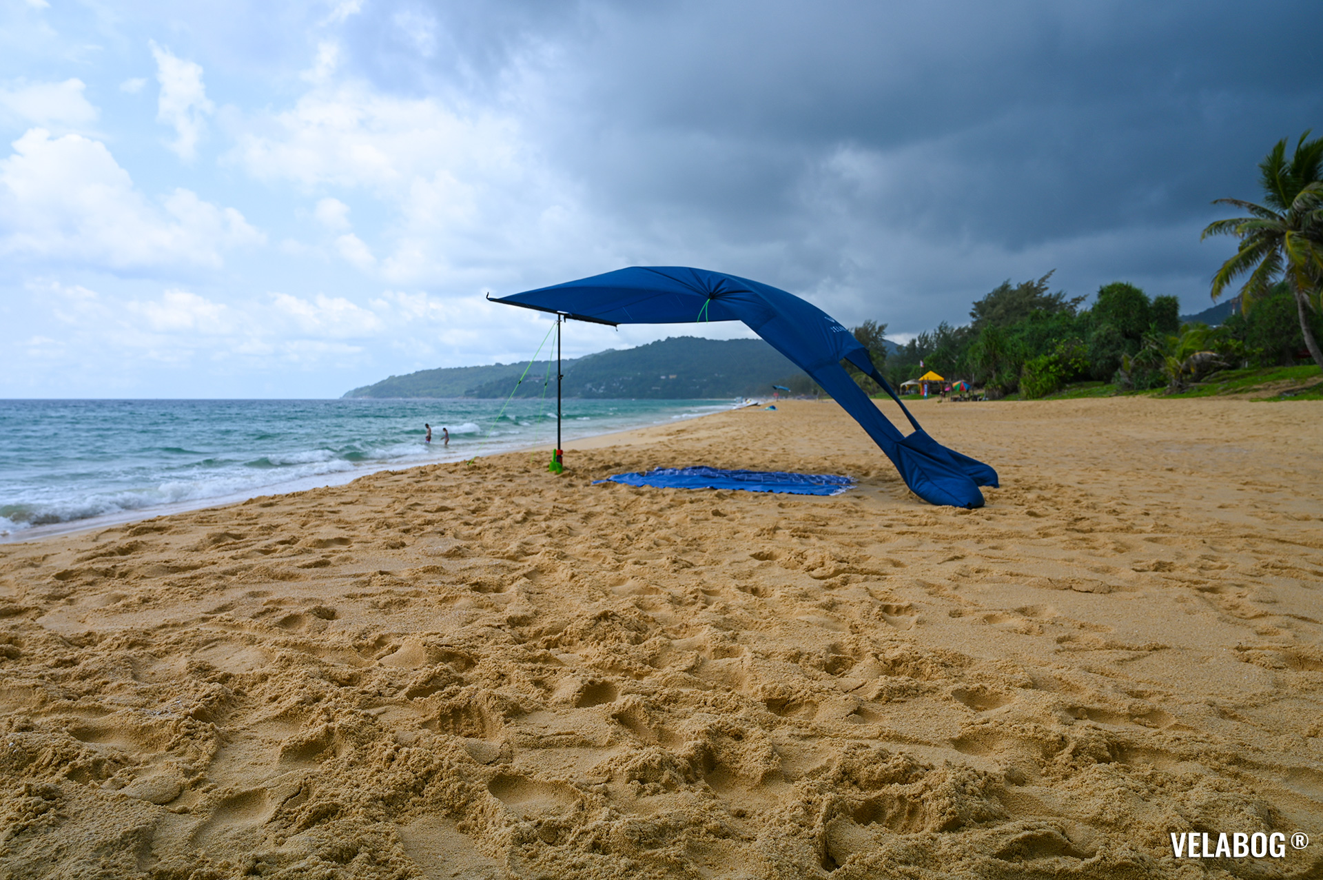 Beach sun sail Velabog Breeze, nightblue. Best rain and sun shelter on the beach, best beach canopy tent. Setup option for light to strong wind. Panorama.