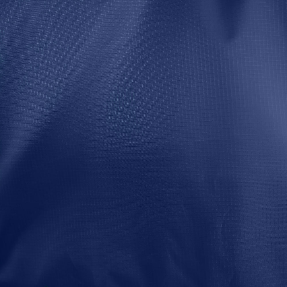 Detail of the fabric surface of the beach sun sail shelter Velabog Breeze. 100% ripstop polyester. Color nightblue.